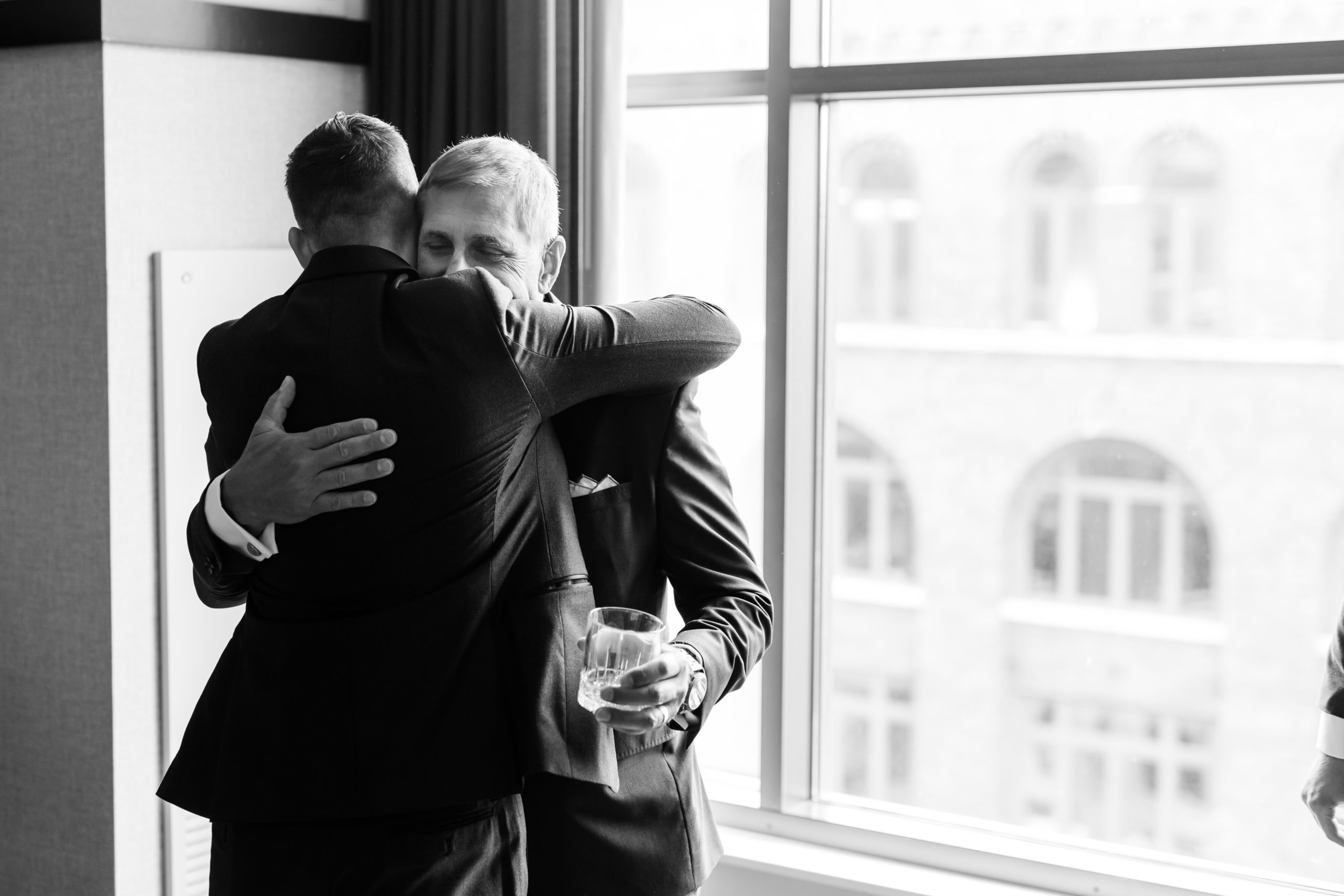 father-groom-hug-wedding-day