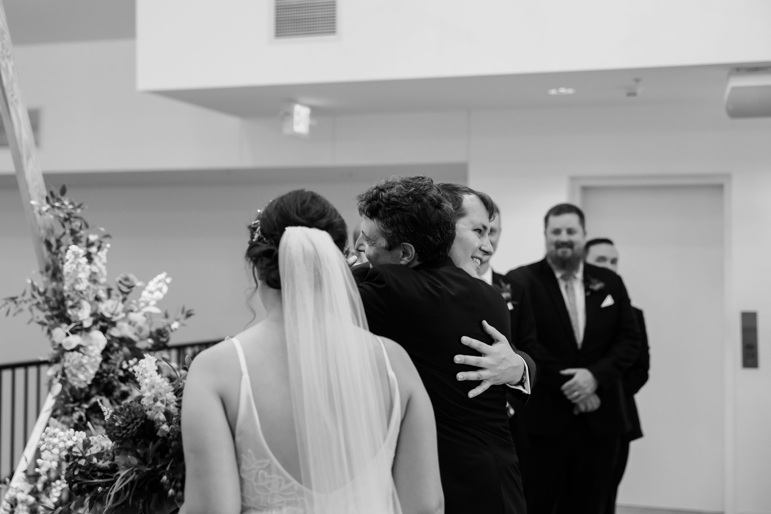 father-groom-ceremony-hug